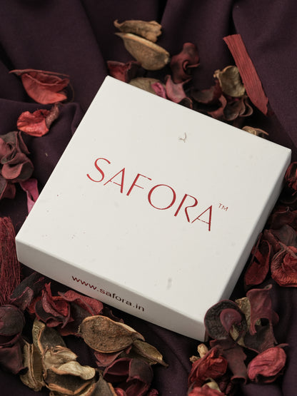 White box with 'SAFORA' branding on a background of dried flowers.
